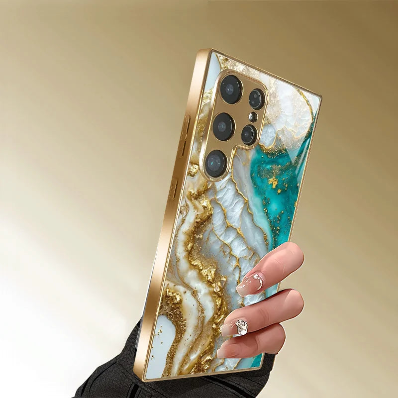 Metallic painted glass phone case from Corporación Turística with artistic pattern, designed to protect and decorate smartphones.