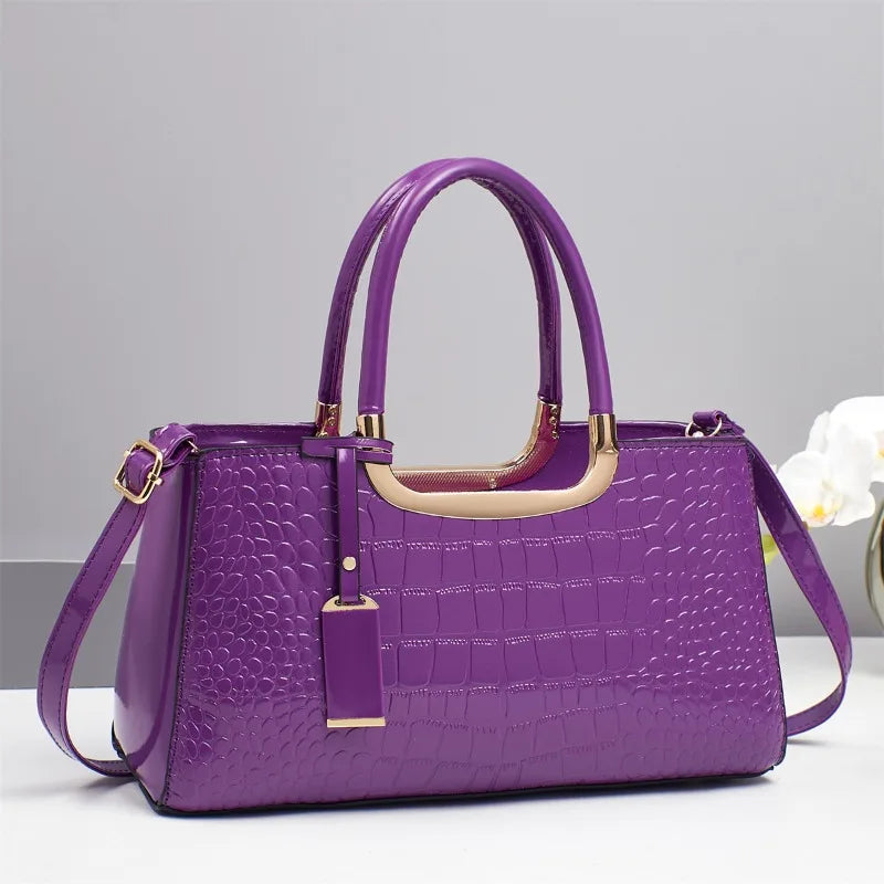 Western-style women's shoulder bag with detailed leather accents, featuring a spacious interior and adjustable strap.
