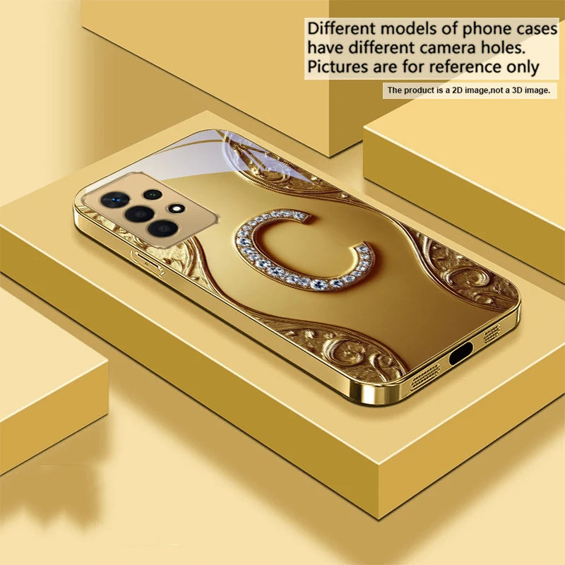 Golden crystal phone case with diamond accents, designed for a sleek and luxurious look on a smartphone.