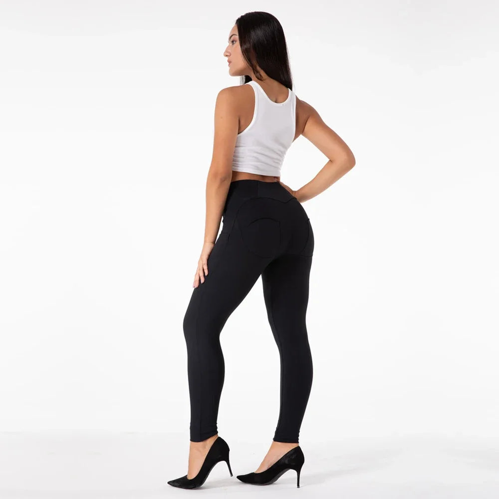 High-waisted black Shascullfites Melody leggings from Corporación Turística, shown on a model with a focus on the fit and fabric.