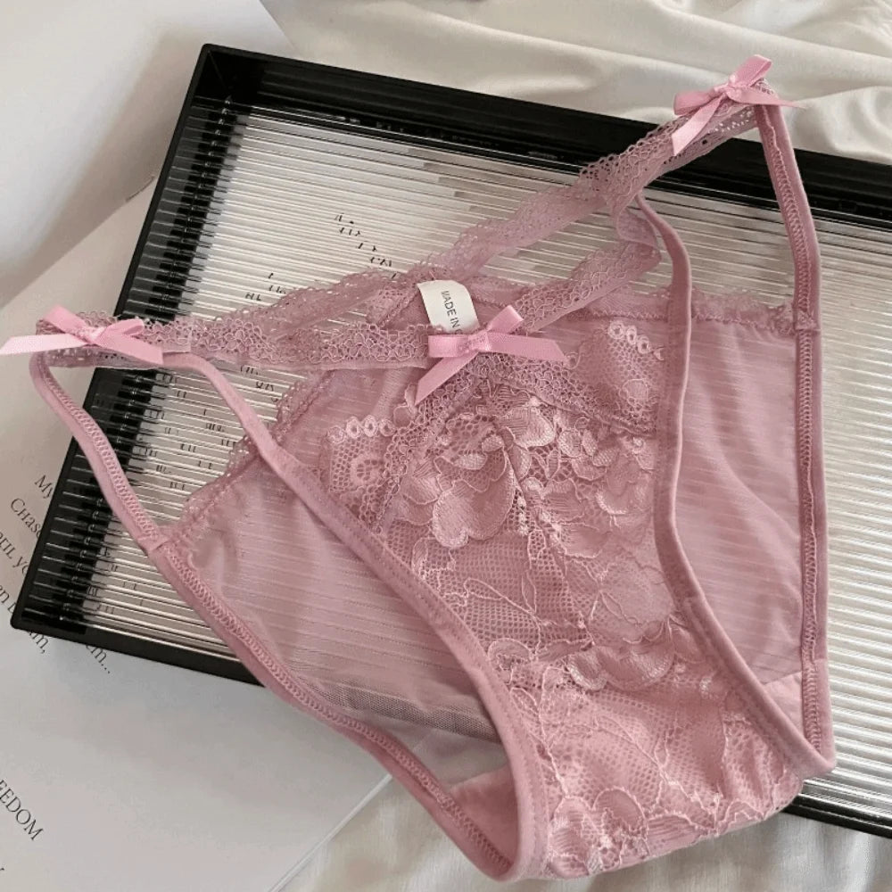 Seamless lace panties with floral design and bow, featuring delicate embroidery for a comfortable and elegant lingerie look.