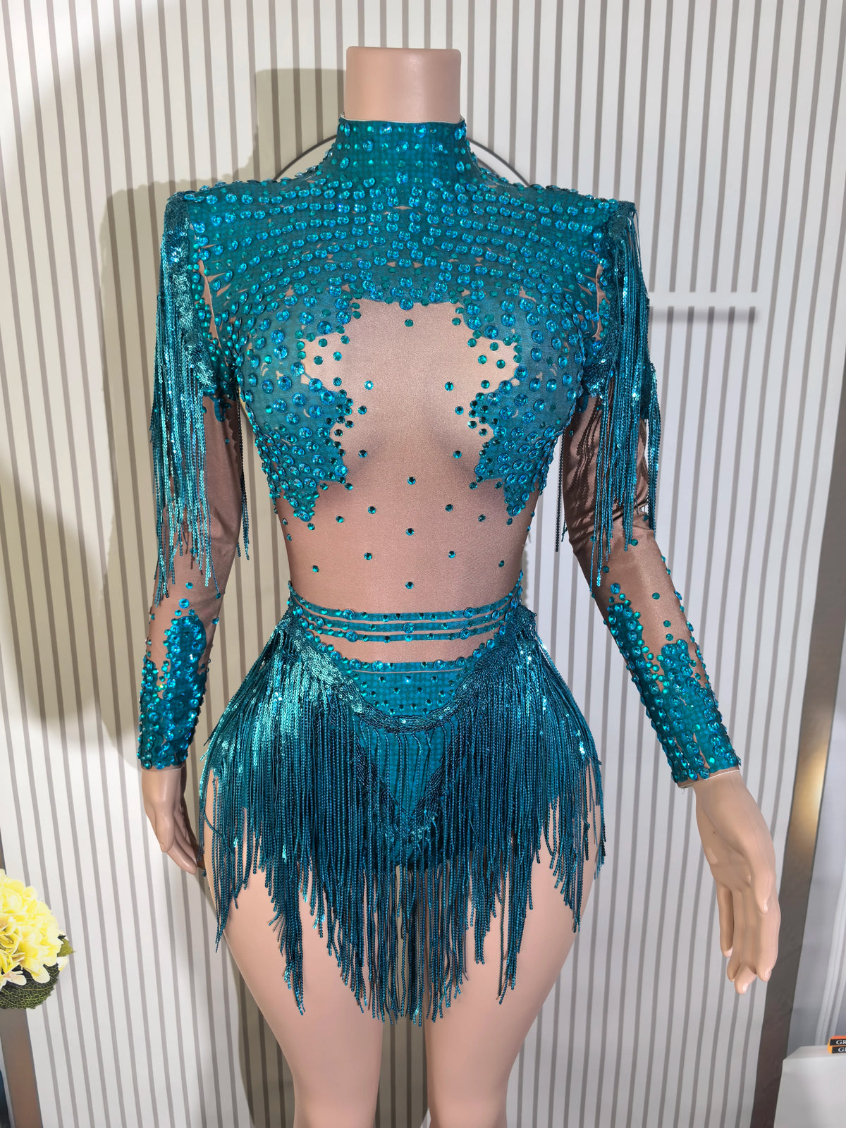 Close-up of a fitted sexy women's dance leotard with shiny embellishments, designed for performance and movement.