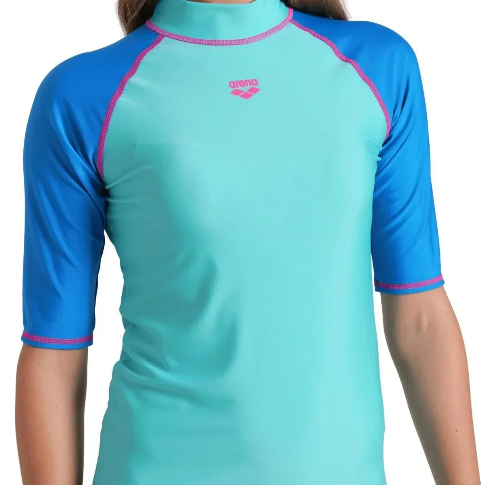 High-elasticity long-sleeve women's T-shirt by Corporación Turística, shown in a close-up of the fitted fabric and design.