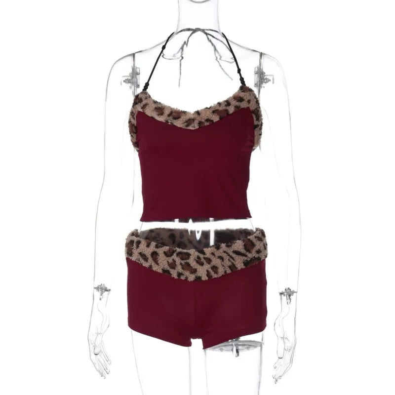 Two-piece matching set featuring a sling and coordinated apparel by Corporación Turística, shown in a stylish, casual design.