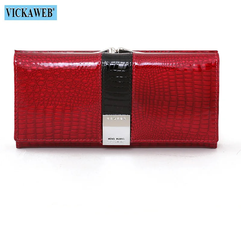 Black leather long wallet by Corporación Turística, featuring a sleek patent finish and multiple card slots.