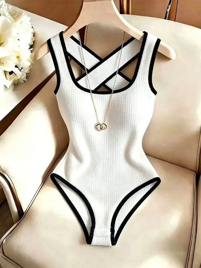 Cream-colored sleeveless ribbed knit body for women with open back from Corporación Turística, fitted and stylish.