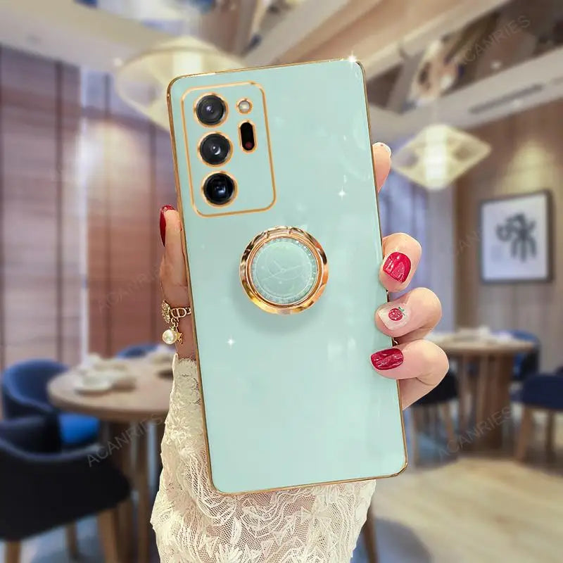 Samsung Note20, Note10, Note9 phone case with built-in ring stand, gold-plated, offering grip and support for hands-free use.