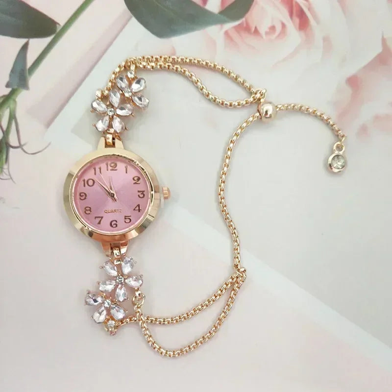 Reloj de cuarzo rosa con detalles brillantes