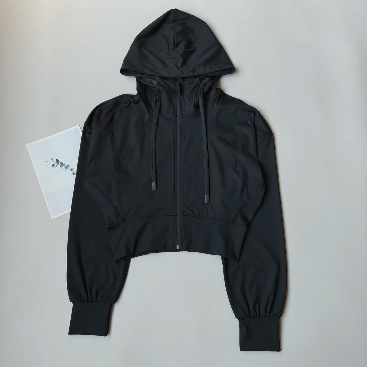 Black breathable sports jacket for women, ideal for running and yoga, from Corporación Turística, in XL size.