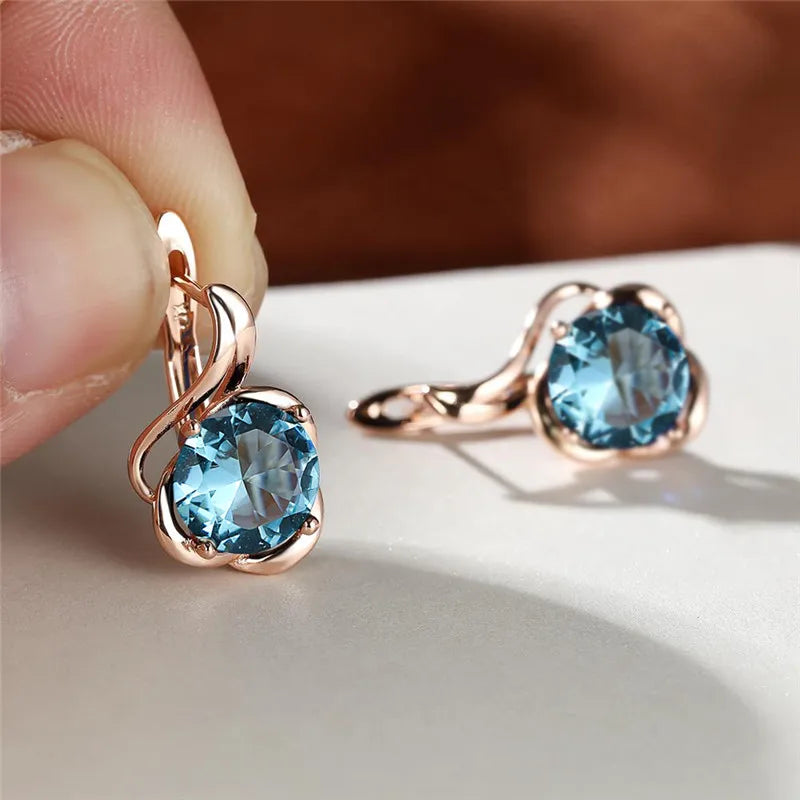 Rainbow cubic zirconia flower mystical earrings with intricate floral design, featuring sparkling stones and silver-tone hooks.