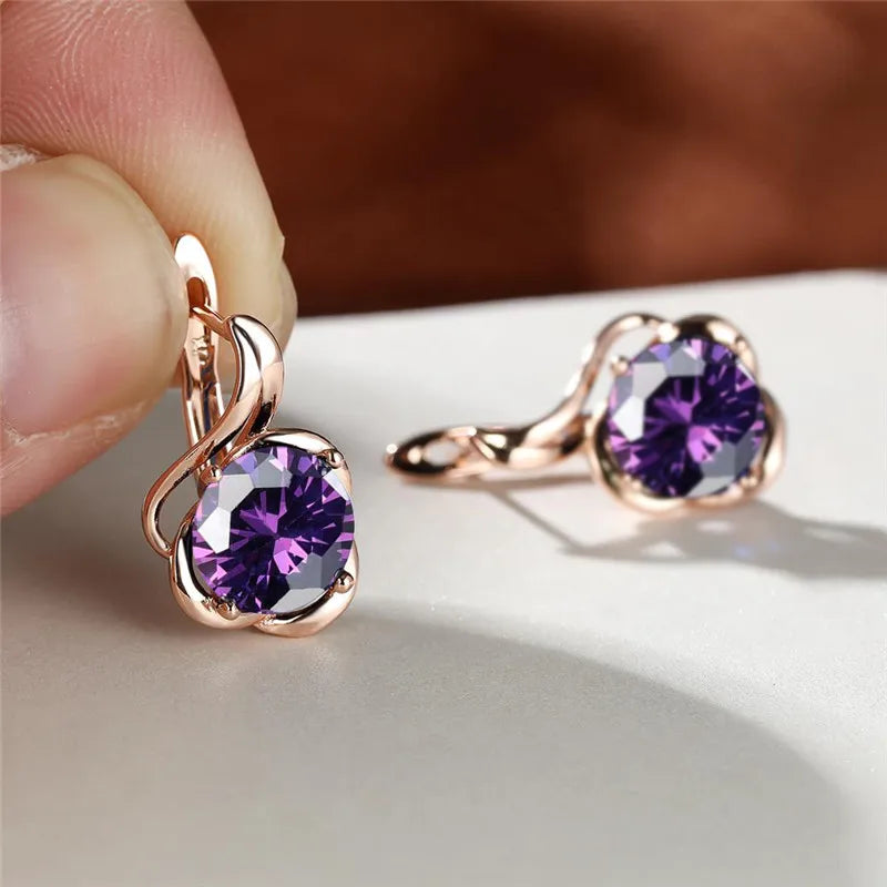 Rainbow cubic zirconia floral mystical earrings with arch-shaped design, featuring vibrant gemstone details.