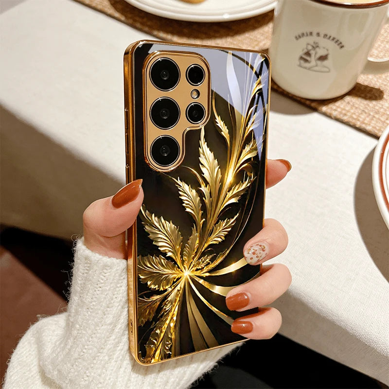 Golden phone case with radiant foliage design, featuring detailed leaf patterns and a sleek finish from Corporación Turística.