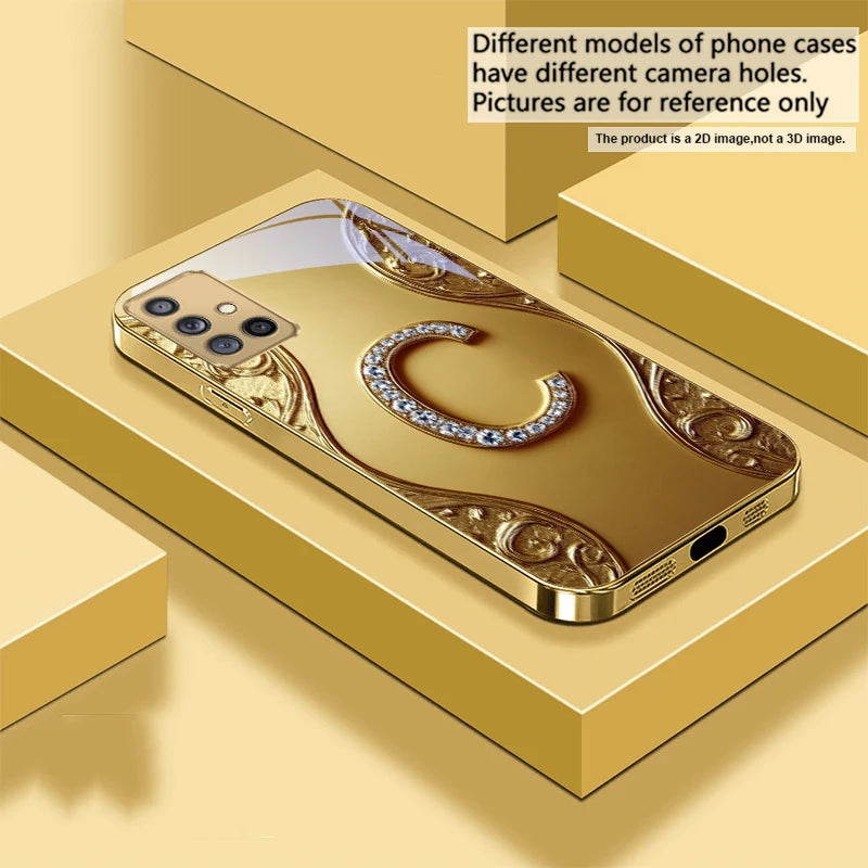 Golden crystal phone case with diamond accents, designed to protect and decorate smartphones with a luxurious touch.