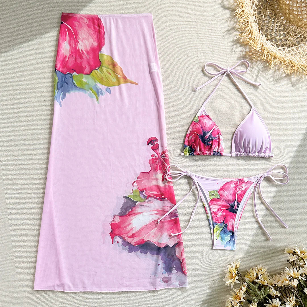 Colorful floral bikini with matching skirt from Corporación Turística, perfect for summer beachwear.