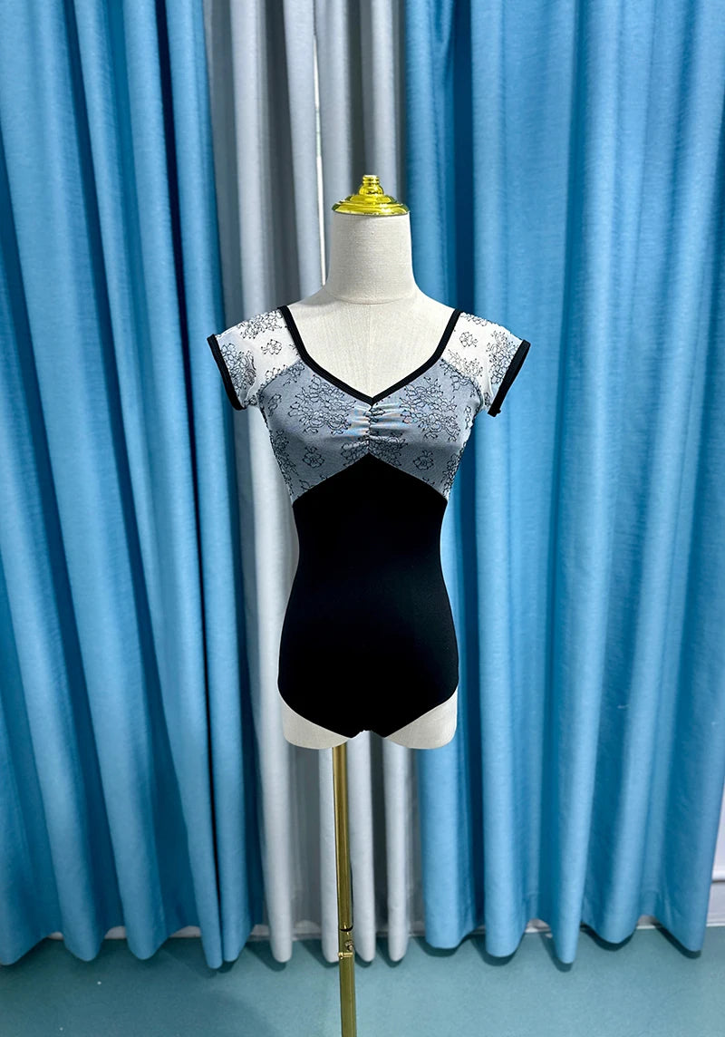 Black women's ballet dance leotard from Corporación Turística, featuring a new design, close-up of the fitted, stretchy fabric.