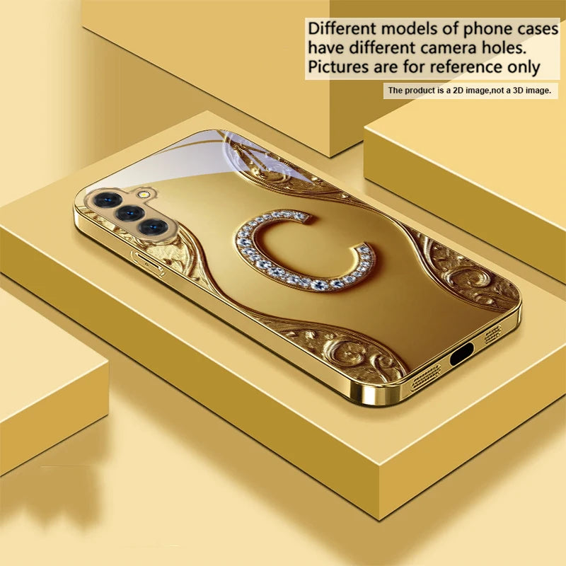Gold crystal phone case with diamond accents, designed for a smartphone, featuring a luxurious and elegant protective cover.