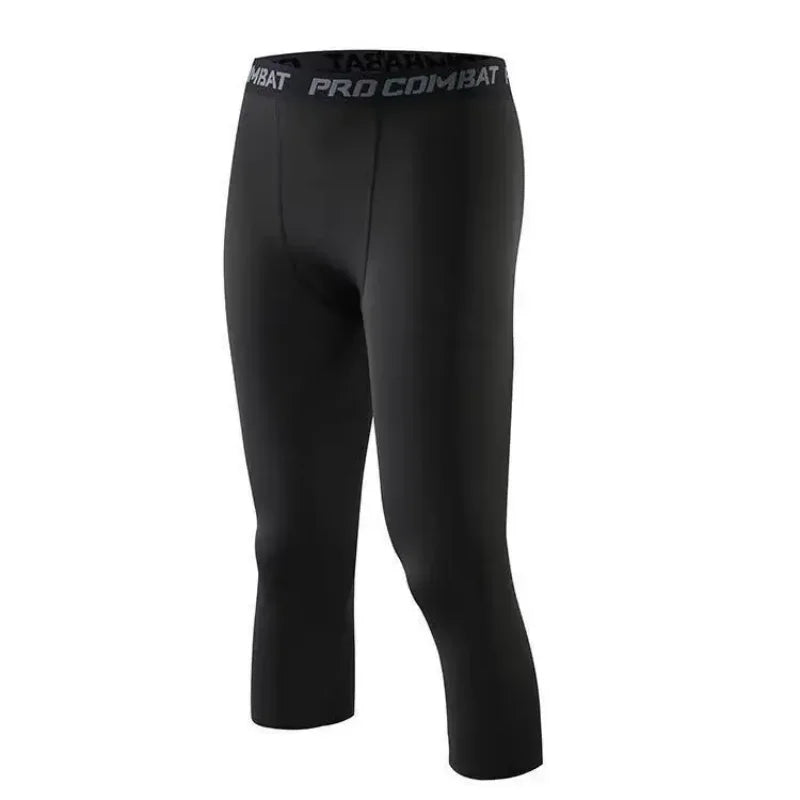Men's compression shorts leggings by Corporación Turística, close-up of black athletic compression pants for sports and performance.