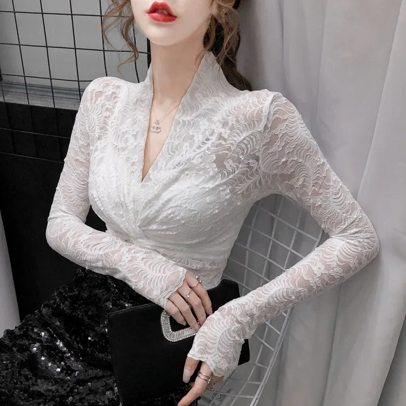 Elegant women's lace blouses with V-neck from Corporación Turística, featuring delicate embroidery and a stylish fit.