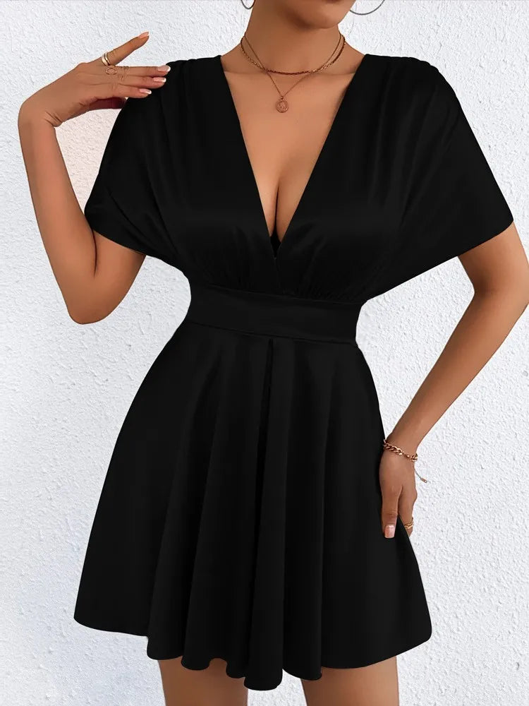 Elegant sexy dress with V-neckline and low waist, featuring a stylish design from Corporación Turística.