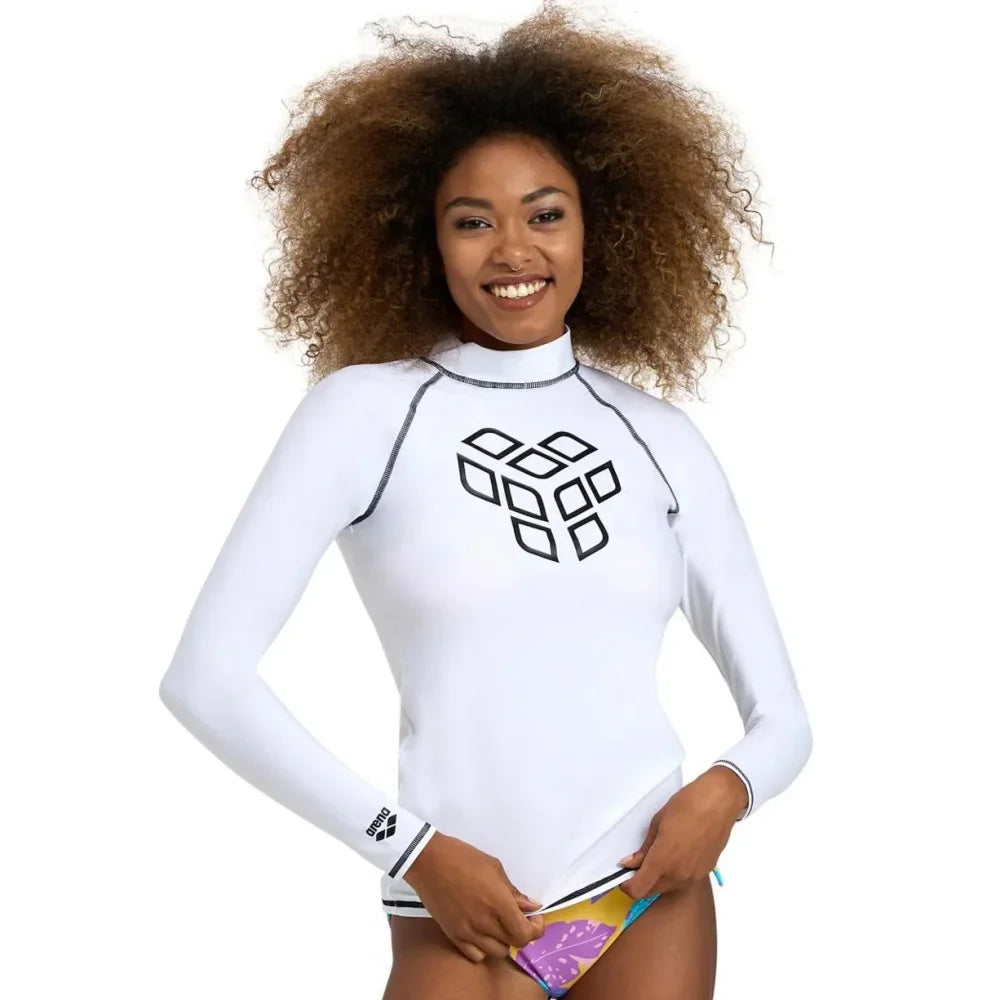 High-elasticity long-sleeve women's T-shirt by Corporación Turística, shown in a close-up of the fitted, stretchy fabric.