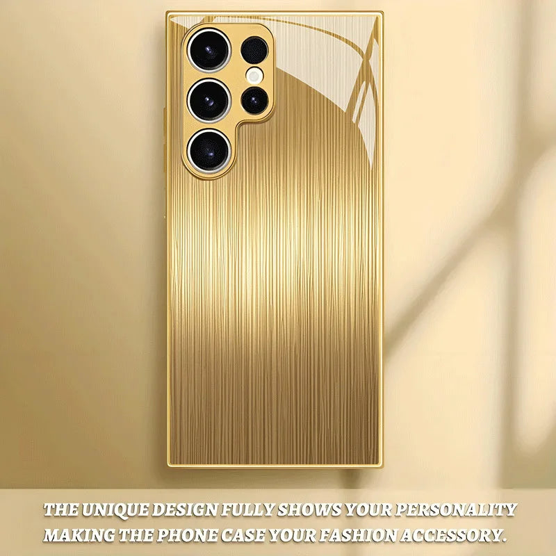 Tempered glass phone case with gold finish, designed for smartphones, featuring a sleek, reflective surface and protective edges.