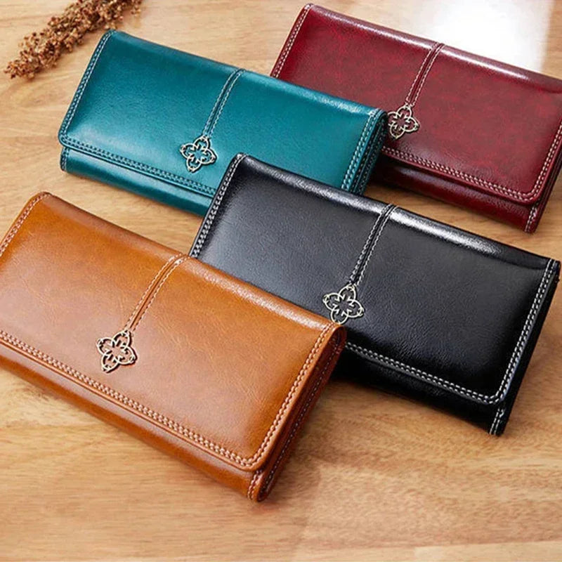 Long women's leather wallet with coin purse and card slots, crafted by Corporación Turística.