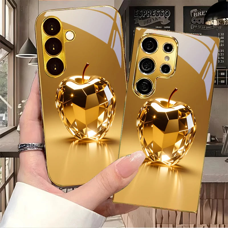 Gold phone case with fruit prism design by Corporación Turística, featuring colorful fruit patterns on a sleek protective cover.