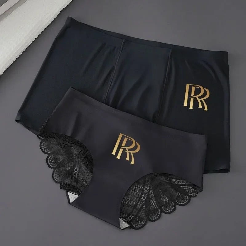 Pair of matching lace couple underwear, sexy boxer style, by Corporación Turística, shown in black with delicate lace details.
