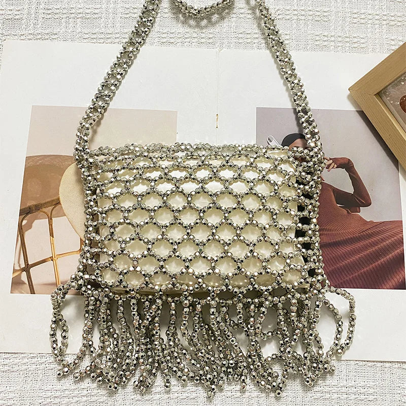 Handmade woven tote bag with colorful beads and tassels from Corporación Turística, featuring intricate textile craftsmanship.