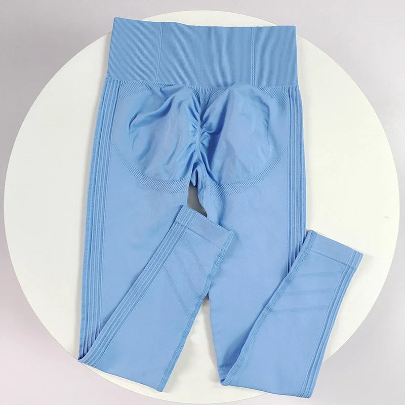High-waisted women's yoga leggings made of seamless fabric, shown in a natural pose, designed for comfort and flexibility.