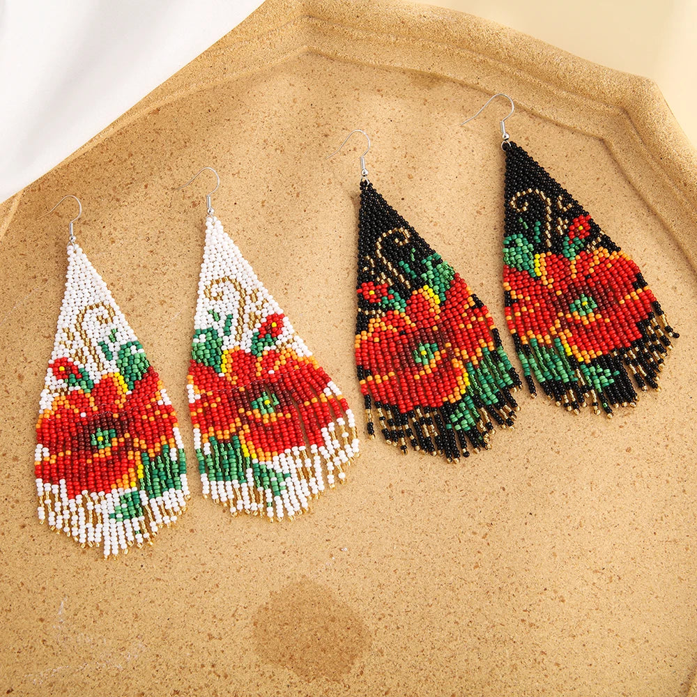 Bohemian style 3D earrings with tassels by Corporación Turística, featuring layered design and vibrant boho-inspired details.