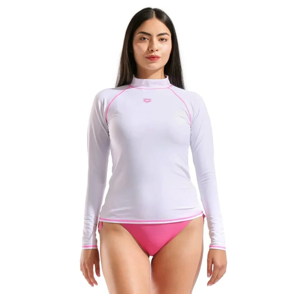 High-elasticity long-sleeve women's T-shirt from Corporación Turística, displayed on a hanger with a fitted style and soft fabric.