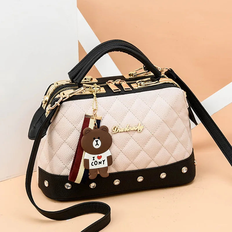 Small high-quality square women's handbag from Corporación Turística, featuring a sleek design and compact size.