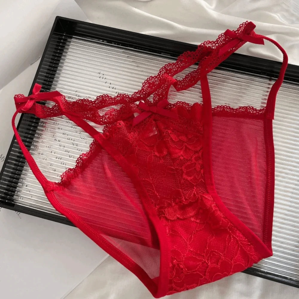 Seamless lace panties with floral embroidery and bow detail, featuring a delicate, feminine design.