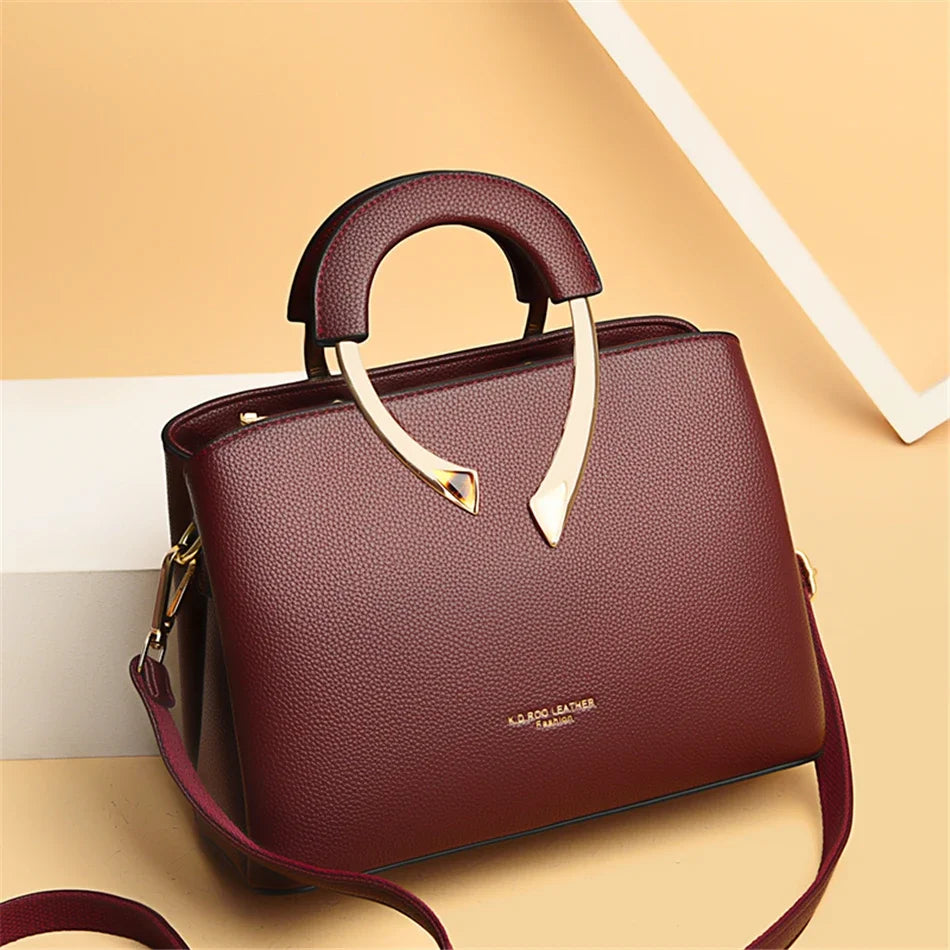 VANDERWAH genuine synthetic leather casual shoulder bag with adjustable strap and minimalist design.