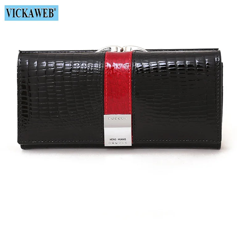 Long leather patent wallet from Corporación Turística, stylish and spacious with multiple card slots and a sleek design.