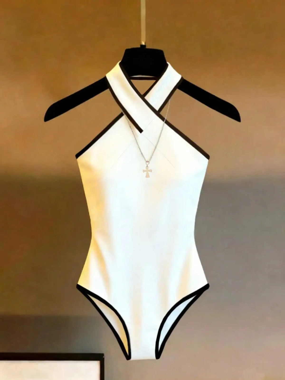 Halter body for women with contrasting trim, from Corporación Turística, showcasing fitted design and stylish detailing.