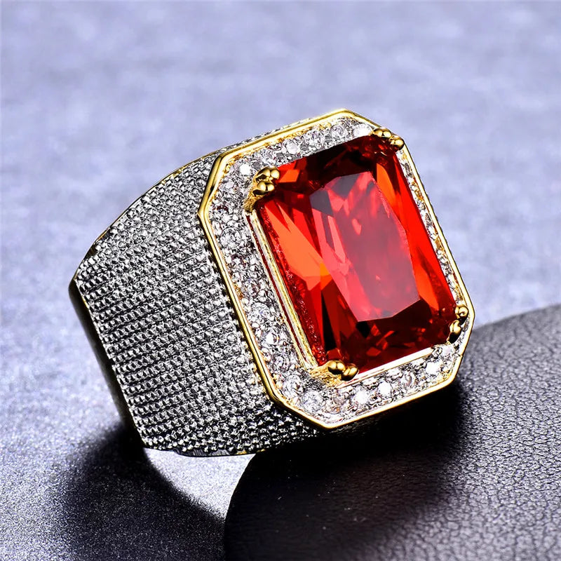 Large red cubic zirconia ring by Corporación Turística featuring a prominent stone and intricate silver band.