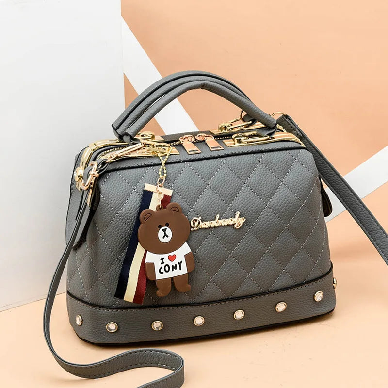 Small square women's handbag in high-quality material, stylish and elegant, by Corporación Turística.