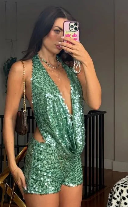 Seamless two-piece sexy sequin crop top and skirt set from Corporación Turística, featuring shiny sequins and sleeveless design.