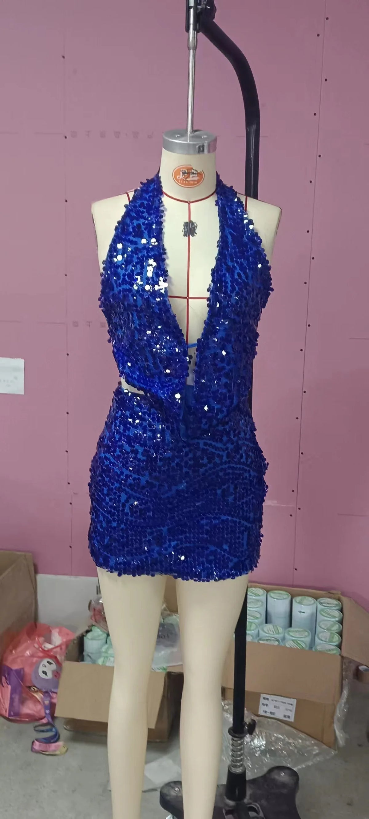 Two-piece sexy sequin crop top and skirt set by Corporación Turística, sleeveless top with shimmering embellishments.