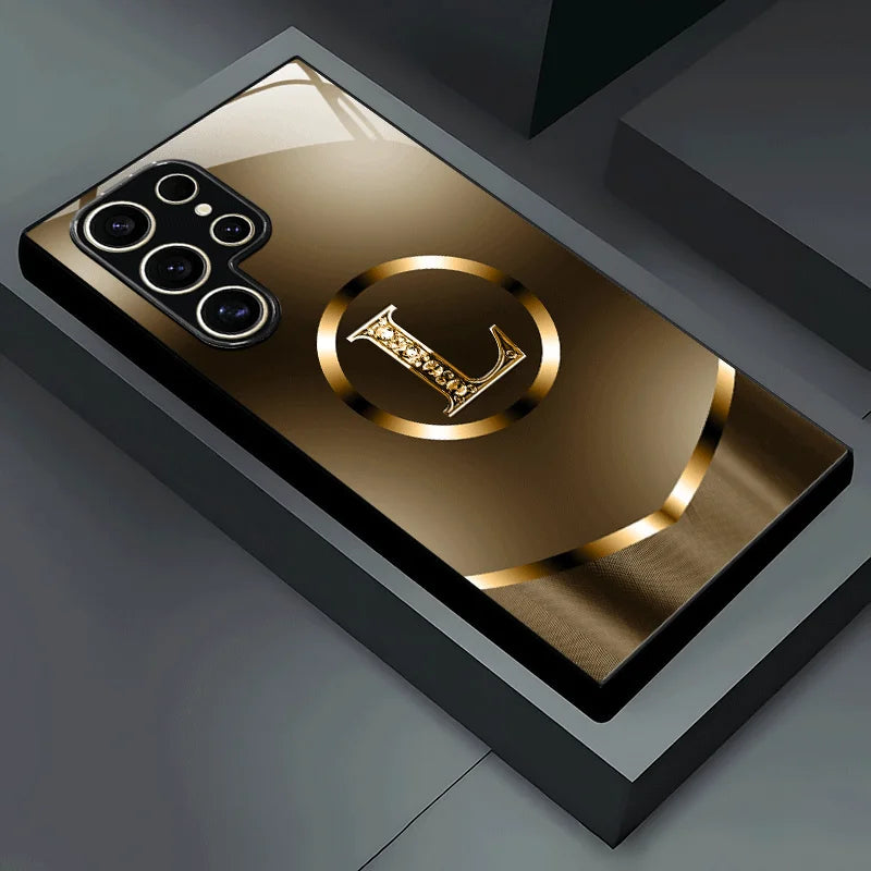 Black glass phone case with the letter L, elegant design, perfect for protecting and customizing your smartphone.