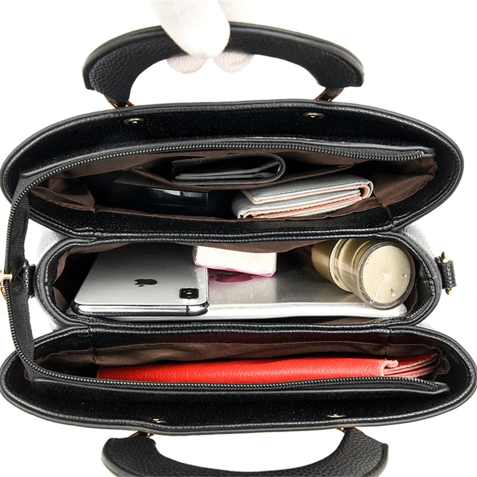 VANDERWAH genuino synthetic leather casual handbag with simple design, featuring a shoulder strap and minimalist style.