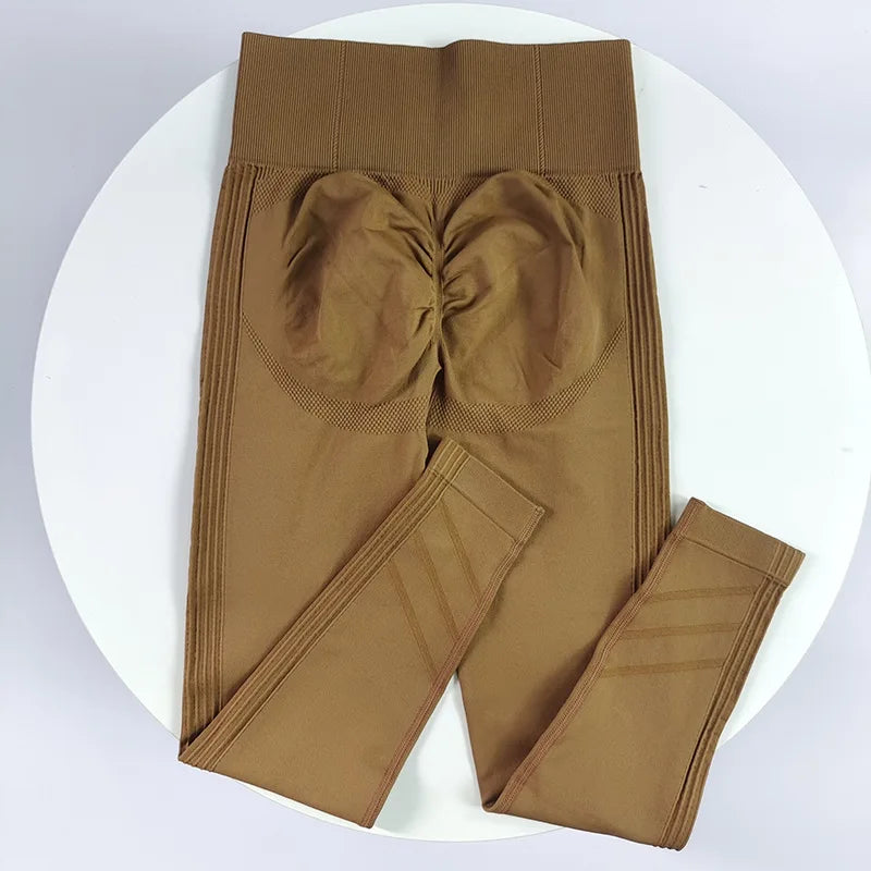 High-waisted women's yoga leggings in stretchy fabric, shown in black, designed for comfort and flexibility during exercise.
