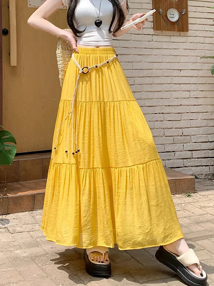 Long boho midi summer skirt made of cotton and linen by Corporación Turística, featuring a flowing design and natural fabric texture.