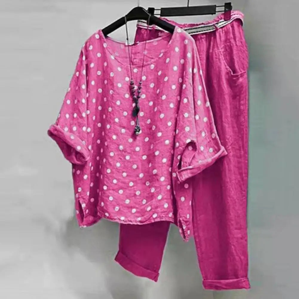 Light-colored women's spring-summer blouse and pants set from Corporación Turística, displayed on a mannequin.