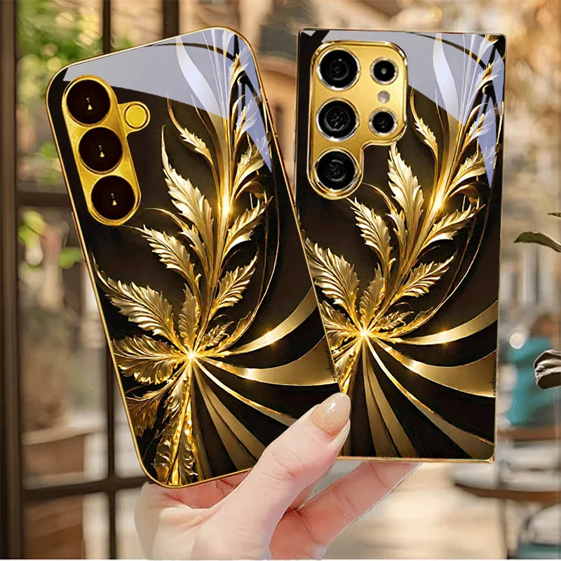Golden phone case with radiant foliage design, showcasing intricate leaf patterns on a sleek protective cover.