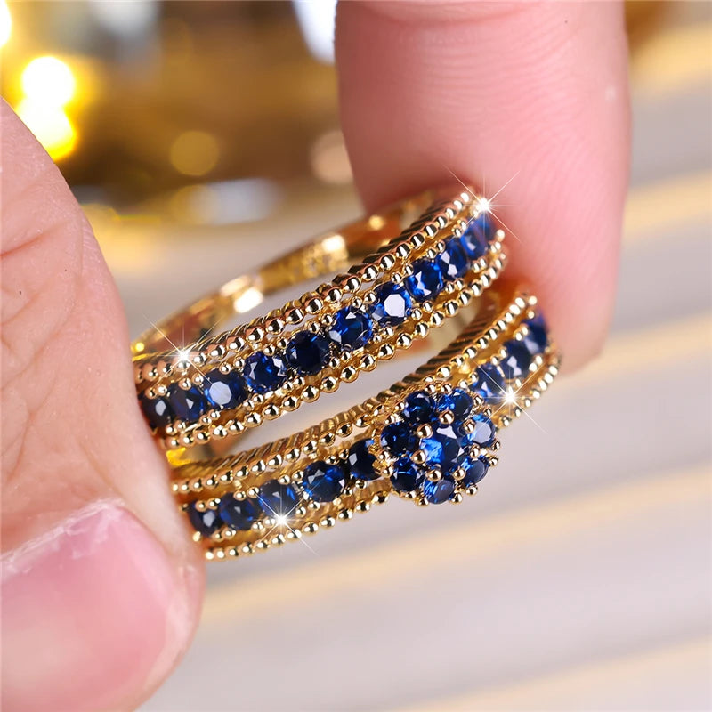 Conjunto de anillos de compromiso de piedra de circón azu...