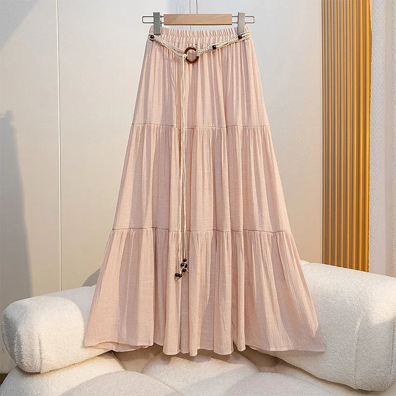 Boho summer midi skirt made of cotton and linen, long flowing design, in soft neutral tones, ideal for casual warm-weather outfits.