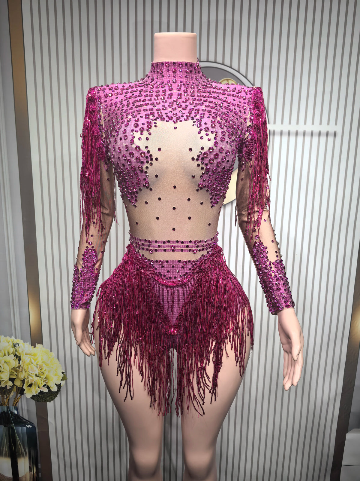 Close-up of a fitted sexy women's leotard by Corporación Turística, featuring a sleek dance costume design with decorative details.